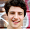 A young man smiling.